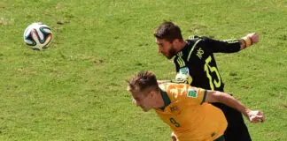 Australia's forward Adam Taggart (L) vies with Spain's defender Sergio Ramos (R) during a Group B football match between Australia and Spain at the Baixada Arena in Curitiba during the 2014 FIFA World Cup on June 23, 2014. AFP PHOTO / LUIS ACOSTA (Photo credit should read LUIS ACOSTA/AFP/Getty Images)