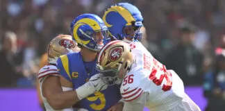 MELBOURNE, AUSTRALIA - SEPTEMBER 11: Matthew Stafford #9 of the Los Angeles Rams is tackled after making a pass in the first quarter of the NFL football game against the San Francisco 49ers at the Melbourne Cricket Ground on September 11, 2026 in Melbourne, Australia. (Photo by Quinn Rooney/Getty Images)