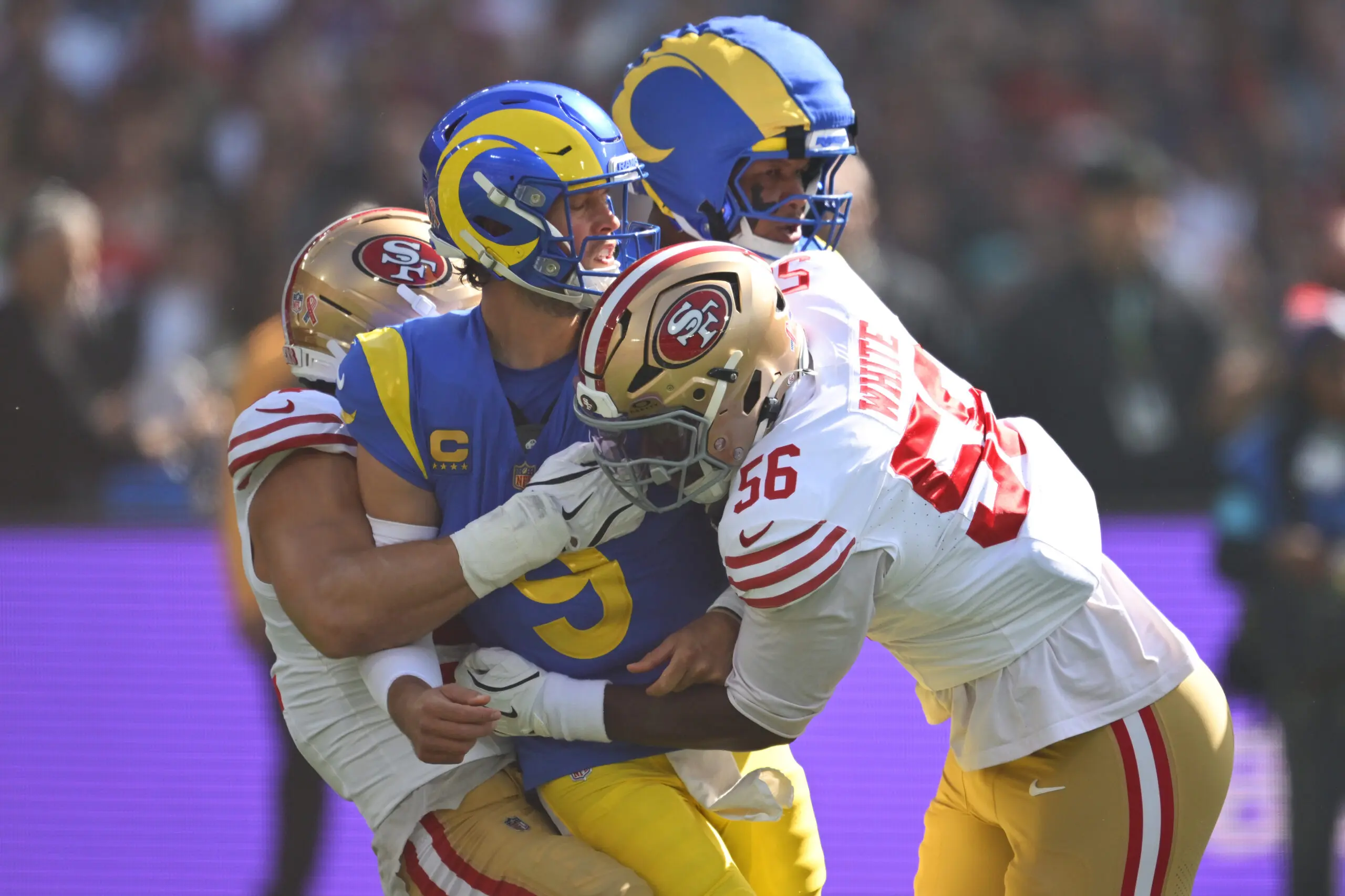 MELBOURNE, AUSTRALIA - SEPTEMBER 11: Matthew Stafford #9 of the Los Angeles Rams is tackled after making a pass in the first quarter of the NFL football game against the San Francisco 49ers at the Melbourne Cricket Ground on September 11, 2026 in Melbourne, Australia. (Photo by Quinn Rooney/Getty Images)