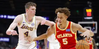 ATLANTA, GEORGIA - NOVEMBER 8: Dyson Daniels #5 of the Atlanta Hawks goes to the basket against Dalton Knecht #4 of the Los Angeles Lakers during the fourth quarter at State Farm Arena on November 8, 2025 in Atlanta, Georgia. NOTE TO USER: User expressly acknowledges and agrees that, by downloading and or using this photograph, User is consenting to the terms and conditions of the Getty Images License Agreement. (Photo by Todd Kirkland/Getty Images)