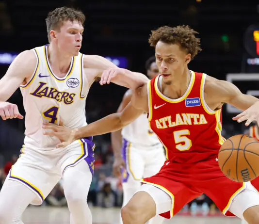 ATLANTA, GEORGIA - NOVEMBER 8: Dyson Daniels #5 of the Atlanta Hawks goes to the basket against Dalton Knecht #4 of the Los Angeles Lakers during the fourth quarter at State Farm Arena on November 8, 2025 in Atlanta, Georgia. NOTE TO USER: User expressly acknowledges and agrees that, by downloading and or using this photograph, User is consenting to the terms and conditions of the Getty Images License Agreement. (Photo by Todd Kirkland/Getty Images)