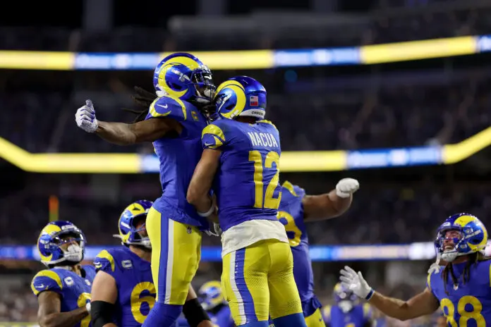 INGLEWOOD, CALIFORNIA - OCTOBER 12: Puka Nacua #12 of the Los Angeles Rams celebrates with Davante Adams #17 after scoring a touchdown against the Buffalo Bills during the fourth quarter of the game at SoFi Stadium on October 12, 2026 in Inglewood, California. (Photo by Luke Hales/Getty Images)
