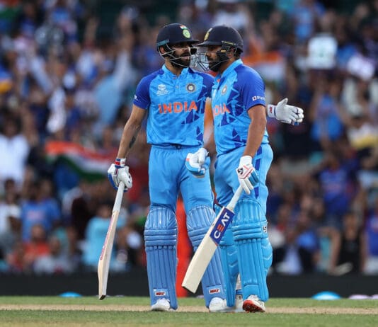 SYDNEY, AUSTRALIA - OCTOBER 27: Virat Kohli of India talks to Rohit Sharma of India during the ICC Men's T20 World Cup match between India and Netherlands at Sydney Cricket Ground on October 27, 2022 in Sydney, Australia. (Photo by Cameron Spencer/Getty Images)