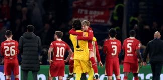PARIS, FRANCE - MARCH 05: Harvey Elliott of Liverpool celebrates with team mate Alisson Becker after the UEFA Champions League 2024/25 Round of 16 first leg match between Paris Saint-Germain and Liverpool FC at Parc des Princes on March 05, 2025 in Paris, France. (Photo by Julian Finney/Getty Images)