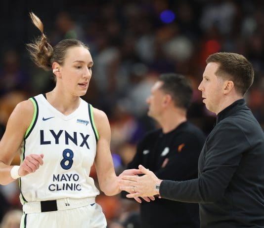 PHOENIX, ARIZONA - SEPTEMBER 28: Acting head coach Eric Thibault of the Minnesota Lynx high fives Alanna Smith #8 during the first half of Game Four of the 2025 WNBA Playoffs semifinals against the Phoenix Mercury at PHX Arena on September 28, 2025 in Phoenix, Arizona. NOTE TO USER: User expressly acknowledges and agrees that, by downloading and or using this photograph, User is consenting to the terms and conditions of the Getty Images License Agreement. (Photo by Christian Petersen/Getty Images)