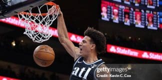 ATLANTA, GEORGIA - FEBRUARY 12:  Jalen Johnson #1 of the Atlanta Hawks dunks against Coby White #0 of the Chicago Bulls during the first quarter at State Farm Arena on February 12, 2024 in Atlanta, Georgia.  NOTE TO USER: User expressly acknowledges and agrees that, by downloading and/or using this photograph, user is consenting to the terms and conditions of the Getty Images License Agreement.  (Photo by Kevin C. Cox/Getty Images)